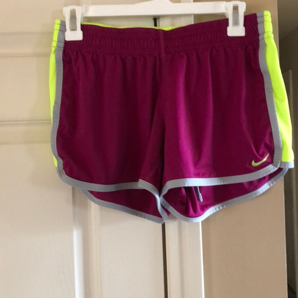 Neon pink Nike running shorts